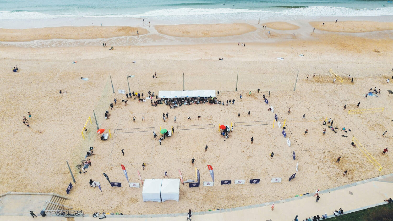 Aerial view of a footvolley tournament on the beach