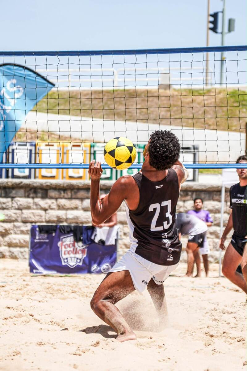 Player controlling the ball at the net during a match