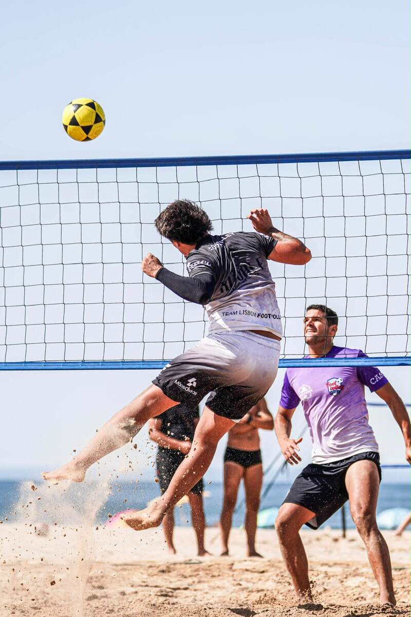 Player jumping to attack the ball over the net